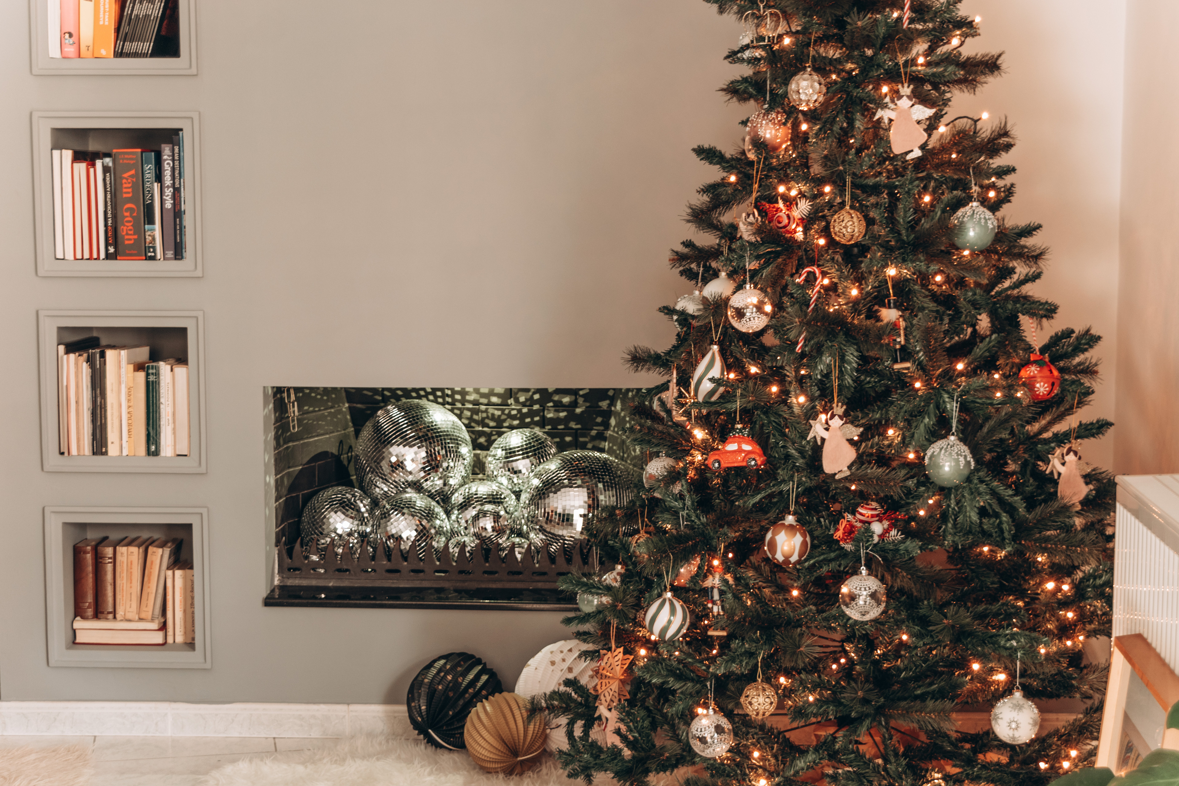 Christmas tree and a fireplace filled with disco balls 