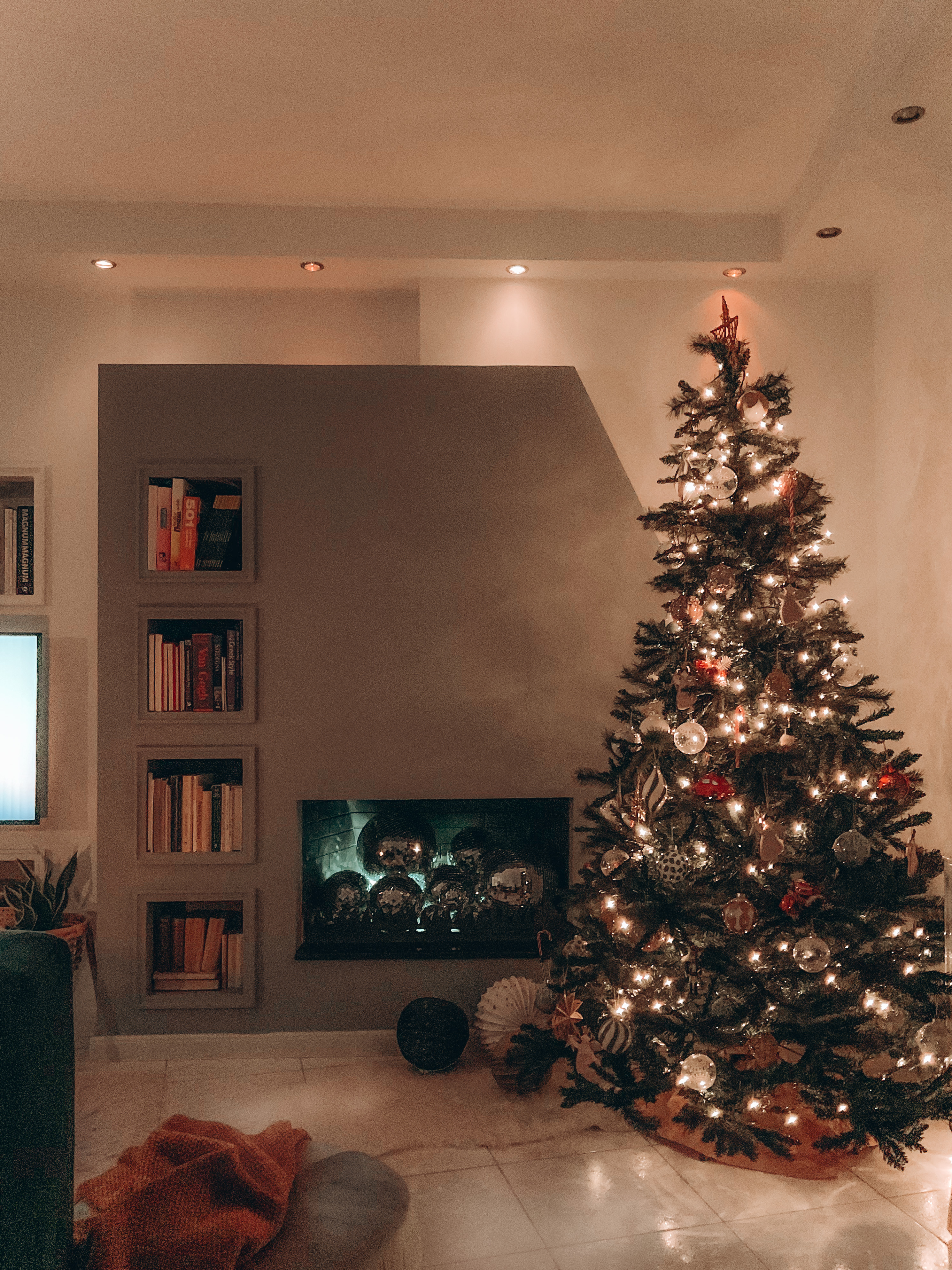 Christmas tree and a fireplace filled with disco balls