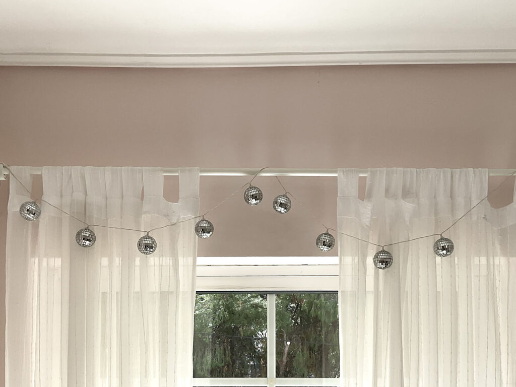 How to decorate with disco balls string of mirror balls on curtain rod